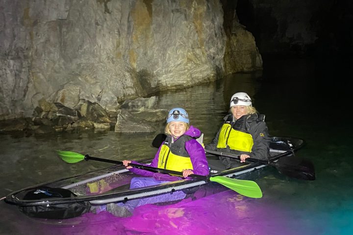 a person sitting on a raft in the water