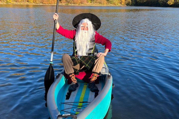 a boat on a lake next to a body of water